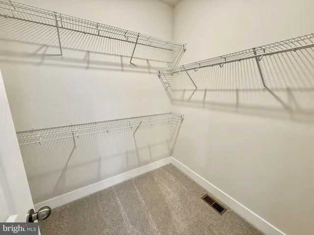 a view of a balcony with wooden floor