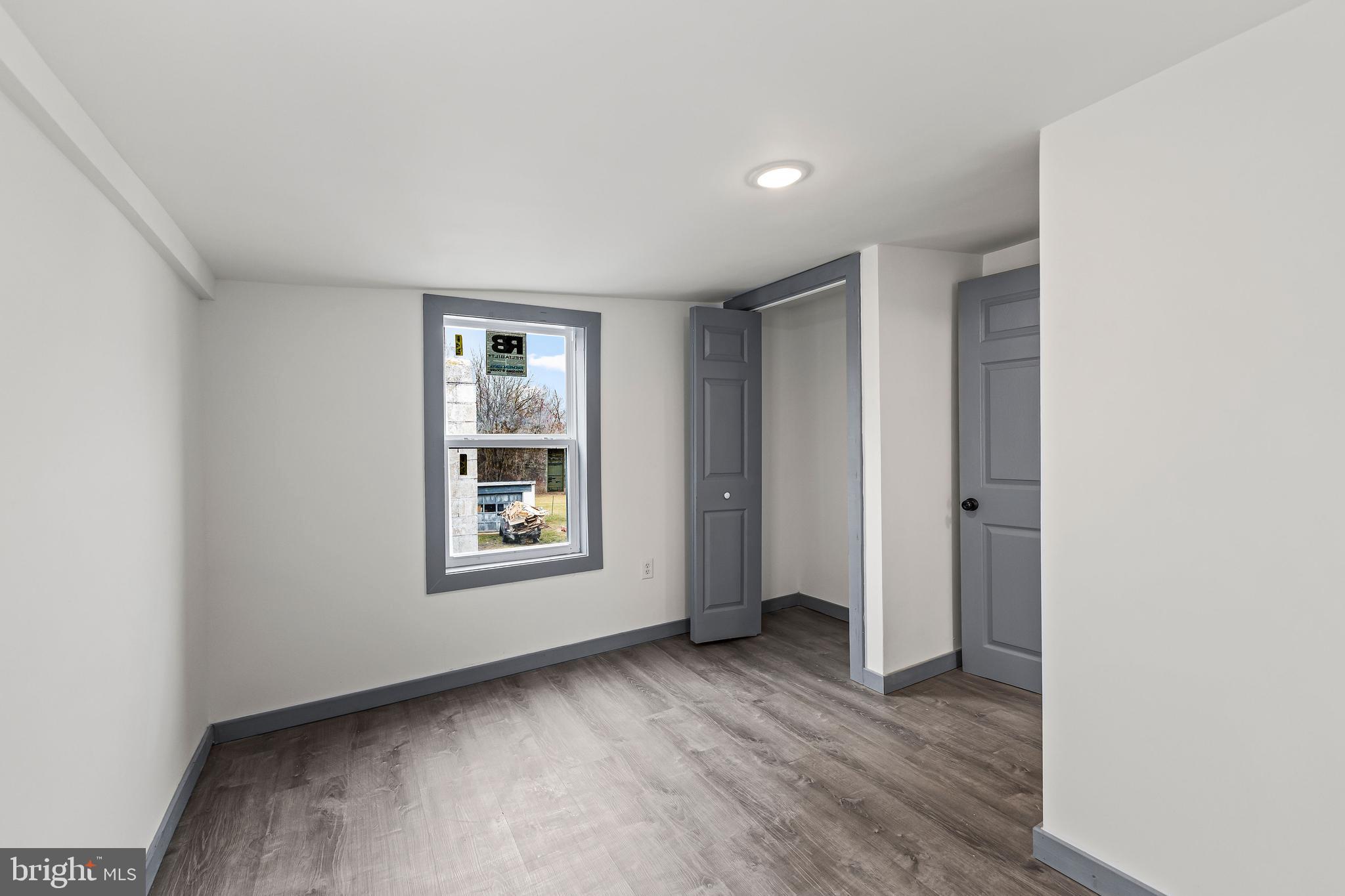 780 White Hall Road Littlestown, PA 17340 - Photo 23 of 36 an empty room with windows and closet