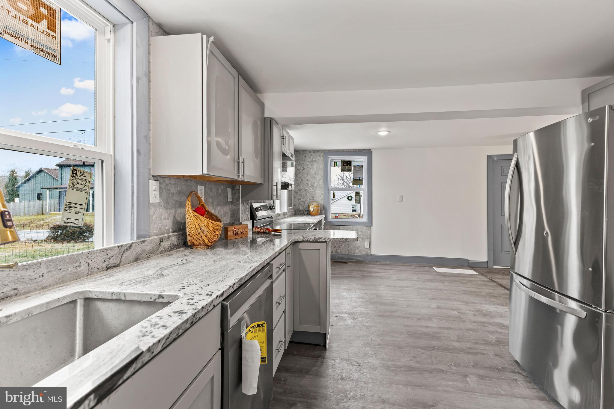 780 White Hall Road Littlestown, PA 17340 - Photo 5 of 36 a kitchen with granite countertop a refrigerator and a sink