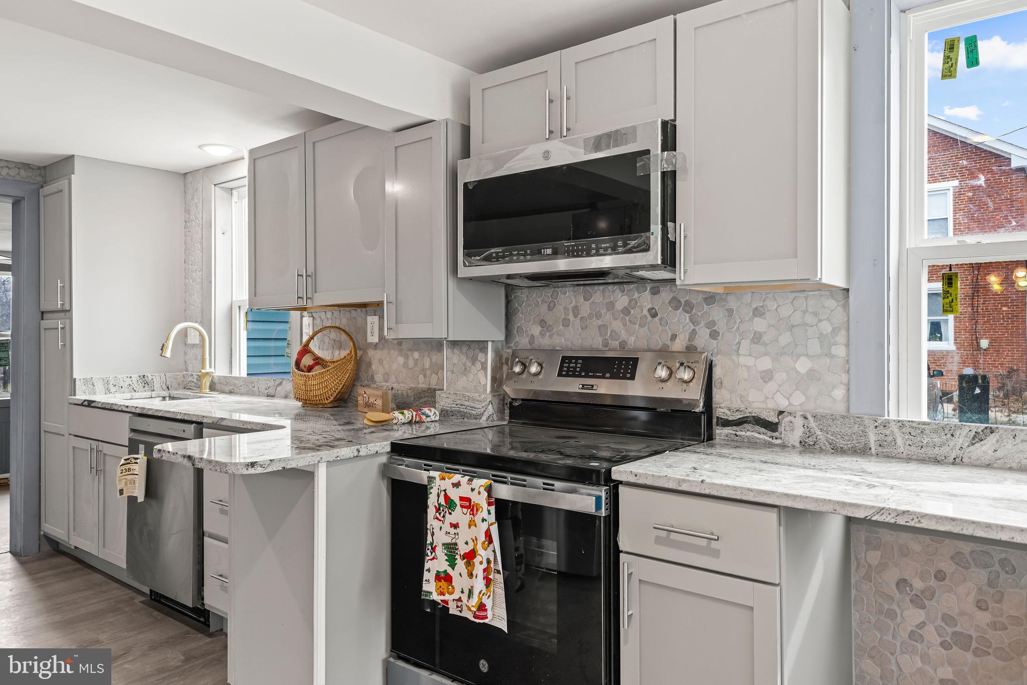 780 White Hall Road Littlestown, PA 17340 - Photo 7 of 36 a kitchen with stainless steel appliances a sink a stove and microwave
