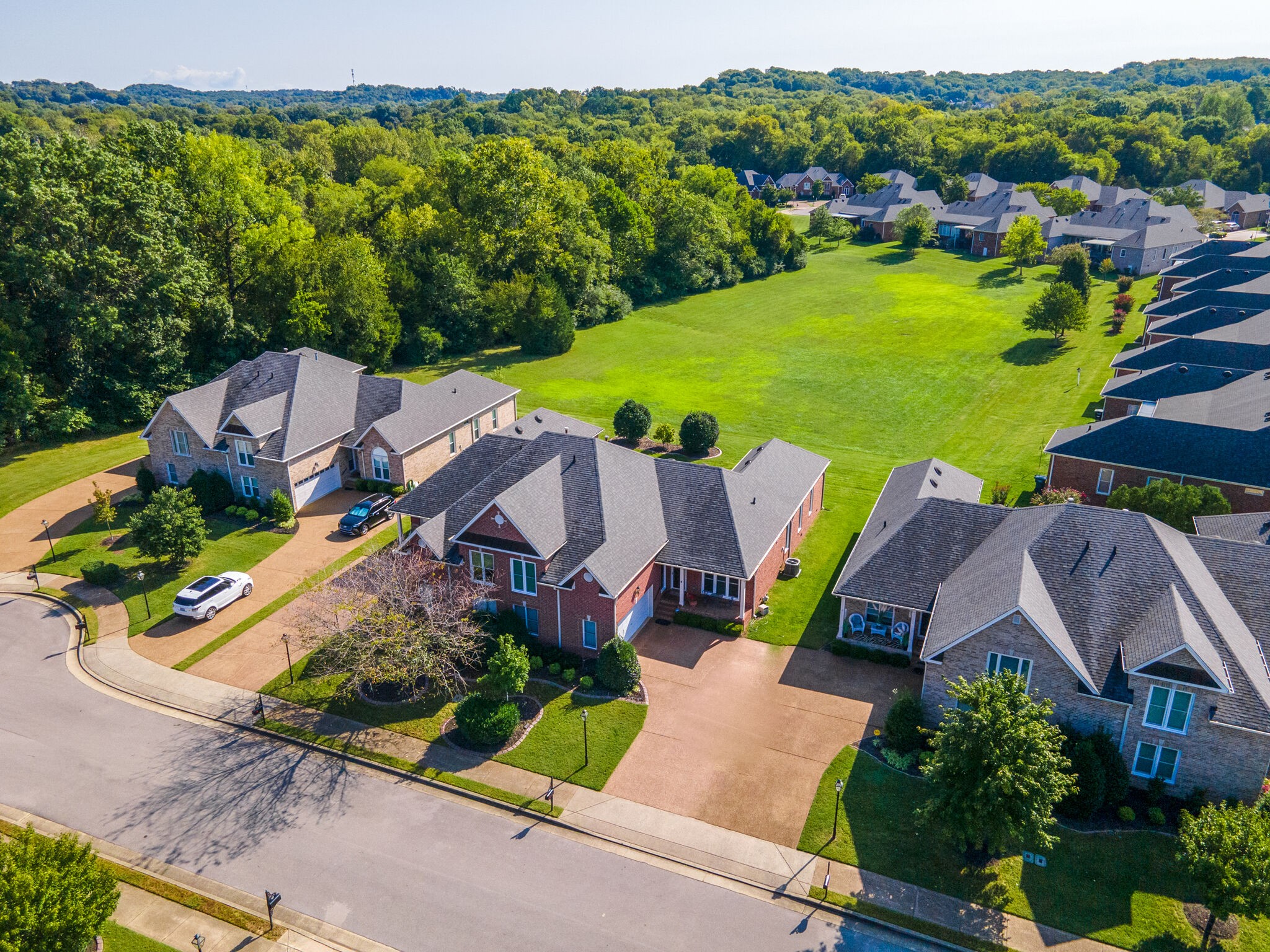 164 Stoners Glen Road Hermitage, TN 37076 - Photo 11 of 37 an aerial view of a house with a garden and lake view