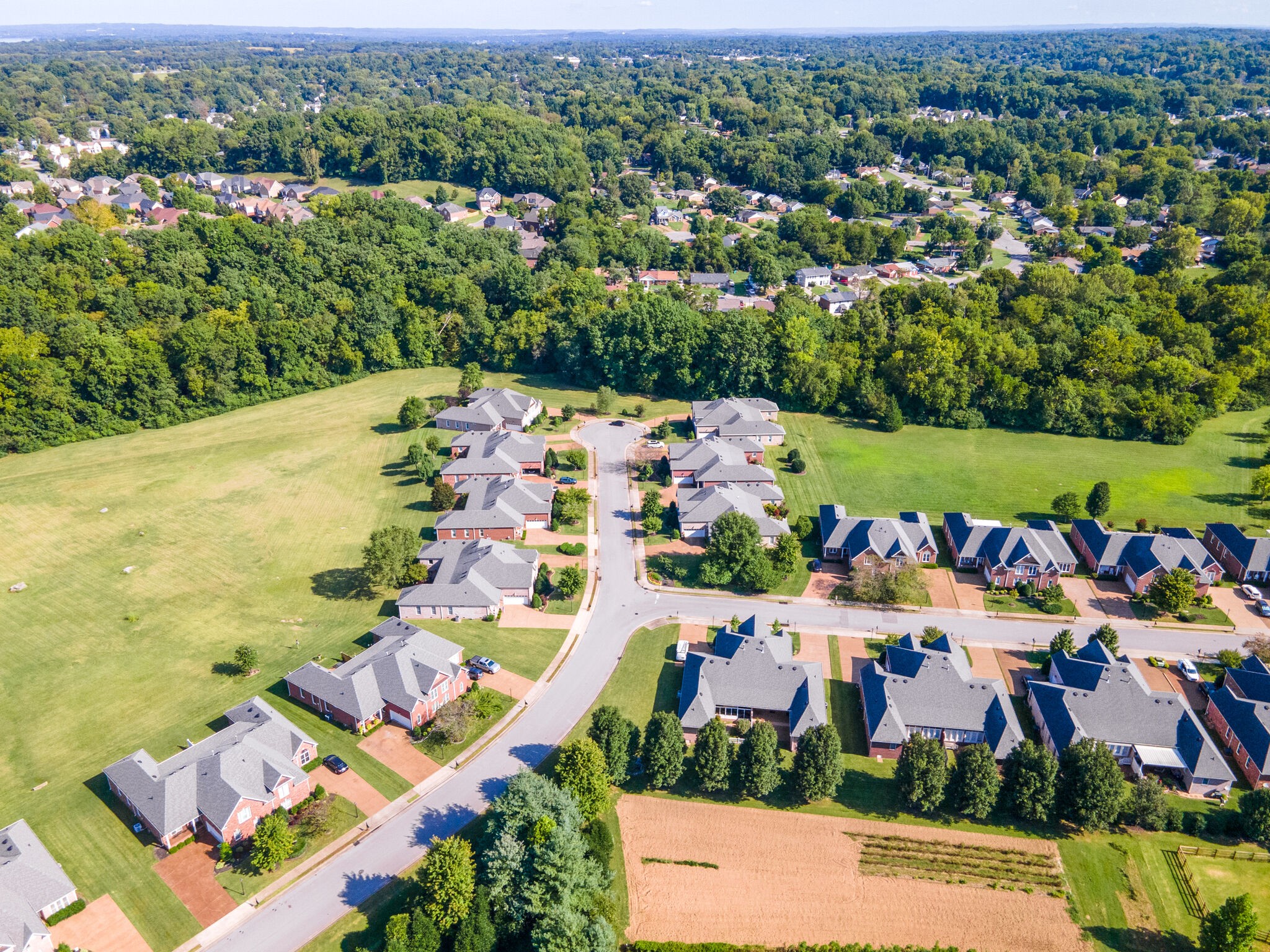164 Stoners Glen Road Hermitage, TN 37076 - Photo 13 of 37 an aerial view of a city with lots of residential buildings ocean and mountain view in back