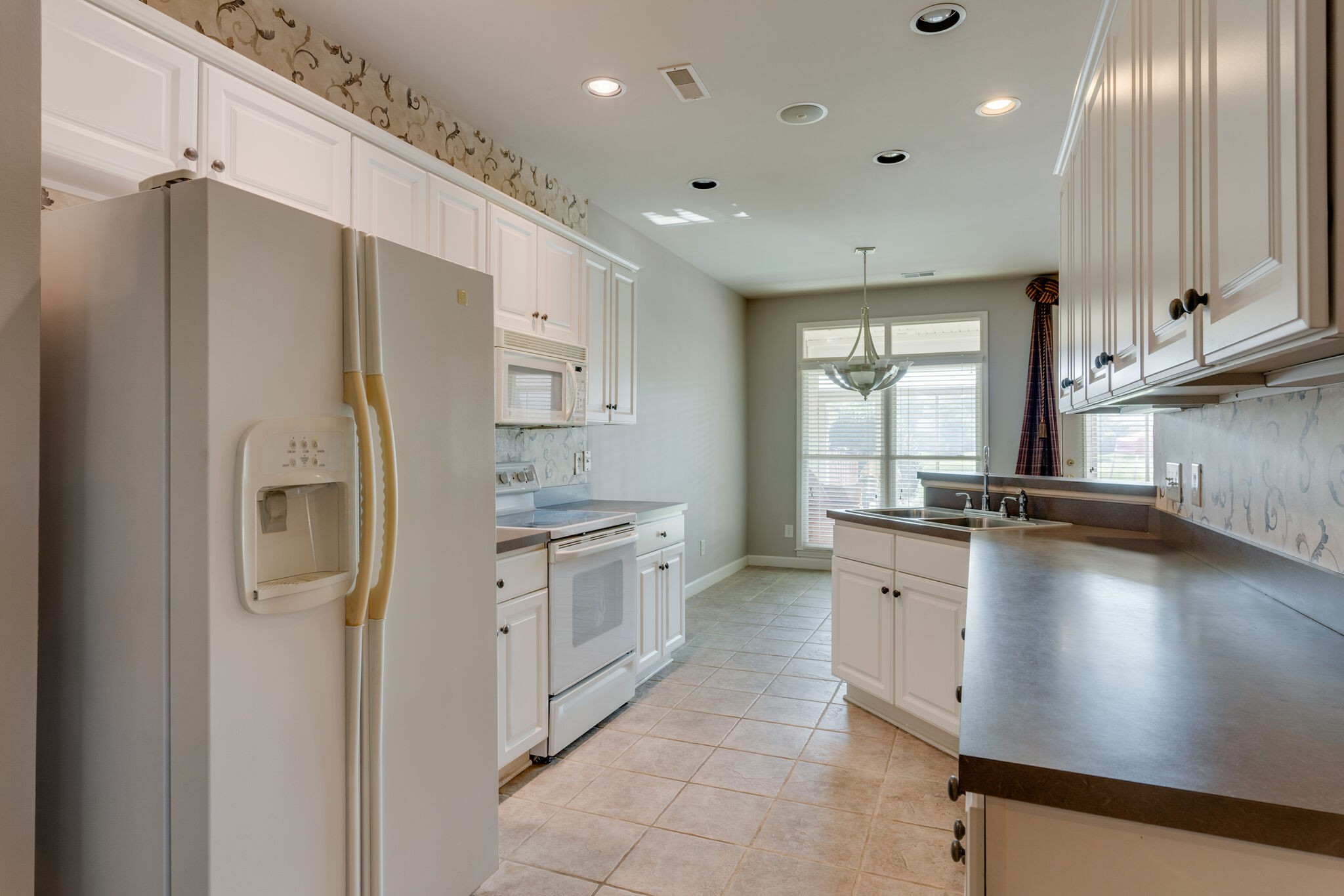 164 Stoners Glen Road Hermitage, TN 37076 - Photo 21 of 37 a kitchen with stainless steel appliances a refrigerator sink and stove