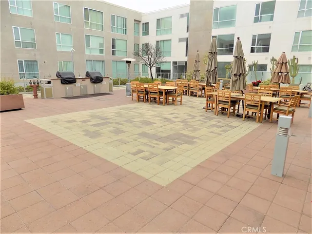 a view of a building with outdoor seating