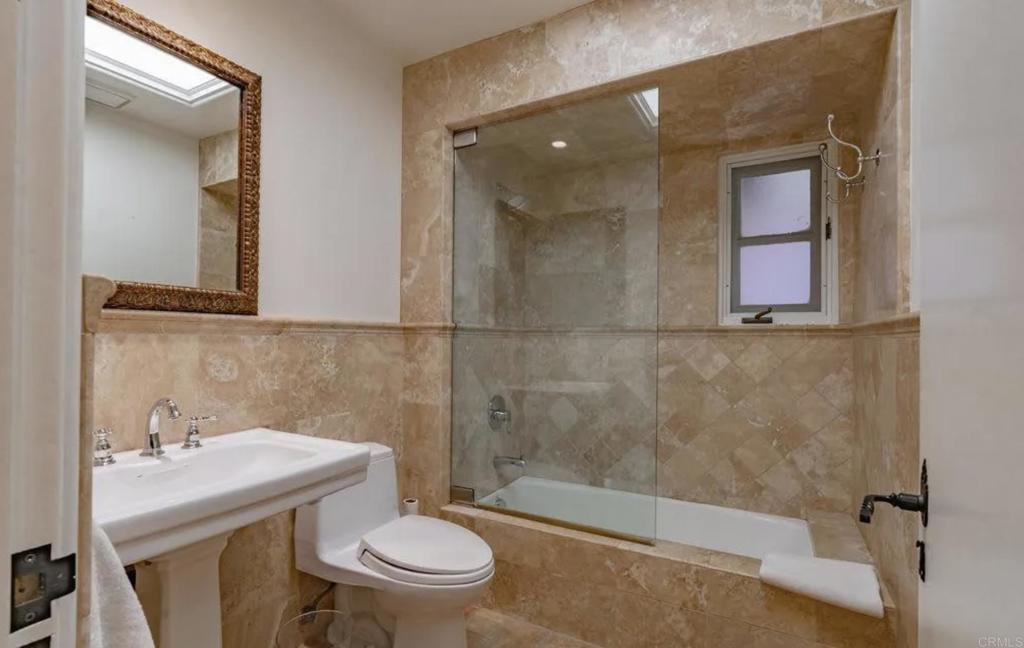 17116 Paseo Hermosa Rancho Santa Fe, CA 92067 - Photo 13 of 28 a bathroom with a sink a toilet and shower