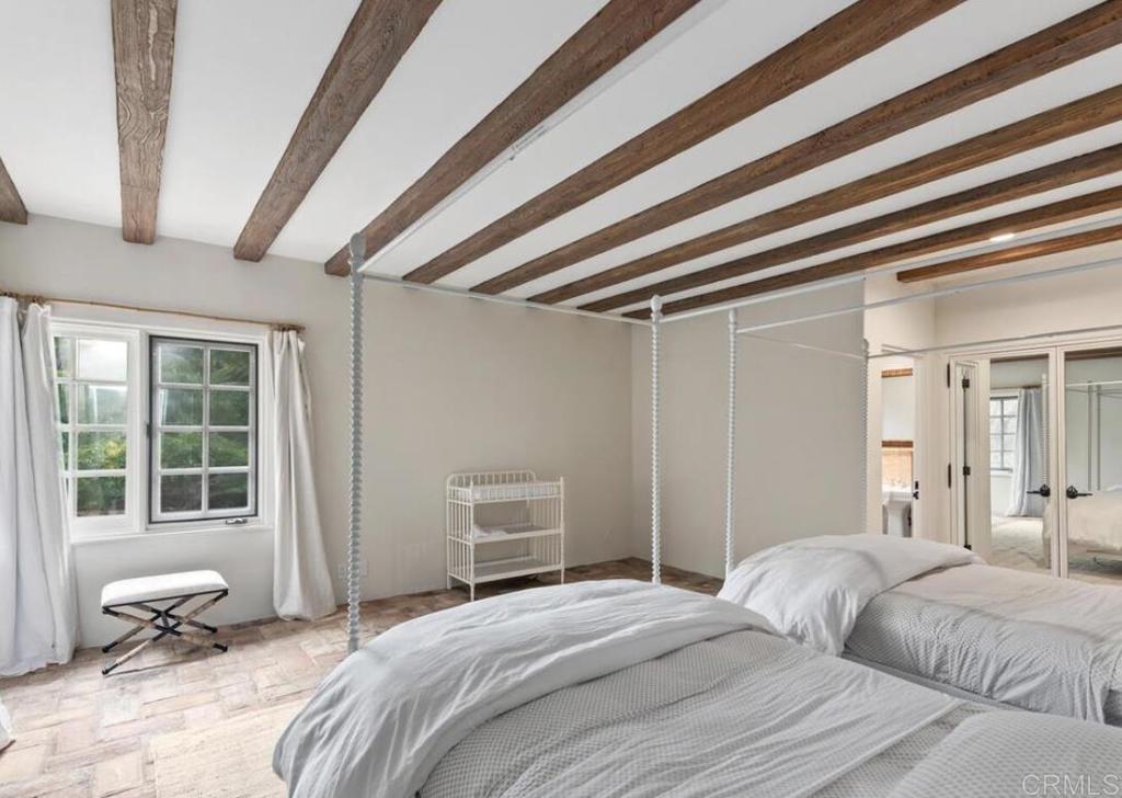17116 Paseo Hermosa Rancho Santa Fe, CA 92067 - Photo 16 of 28 a bedroom with a bed and wooden floor