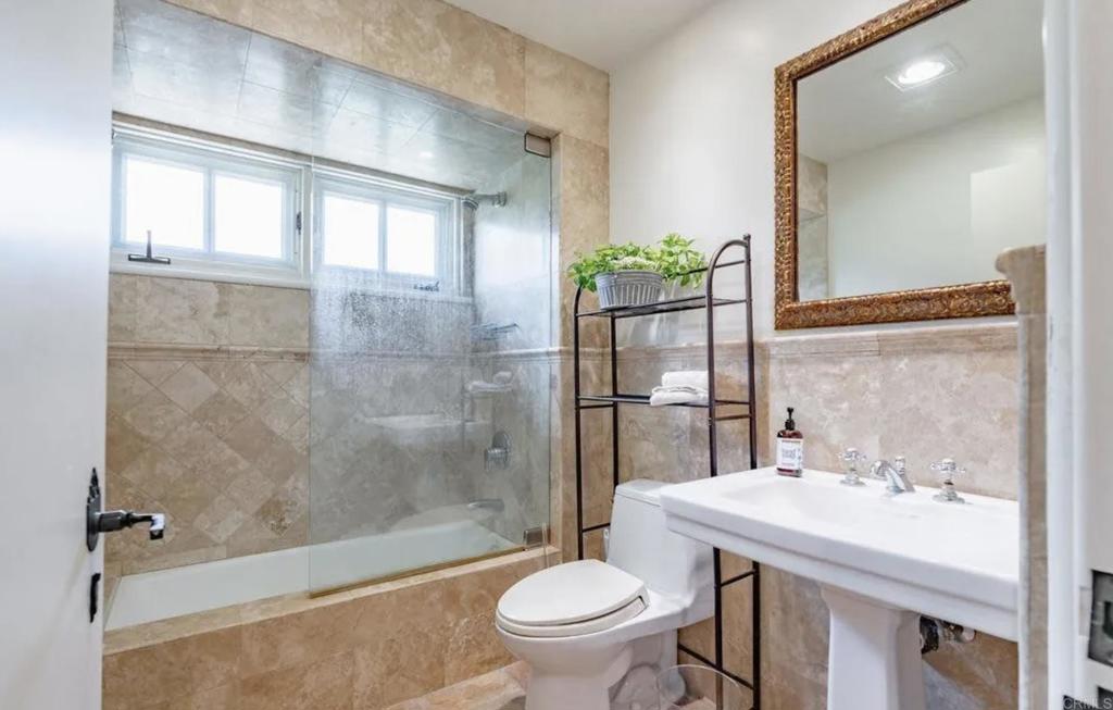 17116 Paseo Hermosa Rancho Santa Fe, CA 92067 - Photo 18 of 28 a bathroom with a sink toilet and shower