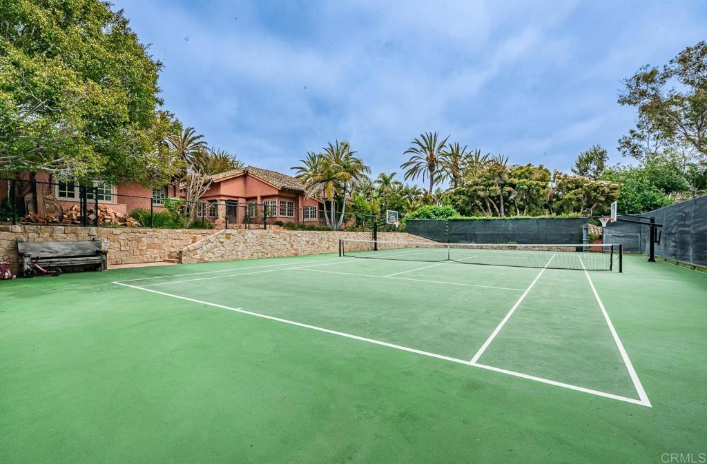 17116 Paseo Hermosa Rancho Santa Fe, CA 92067 - Photo 20 of 28 a view of a tennis ground with large trees