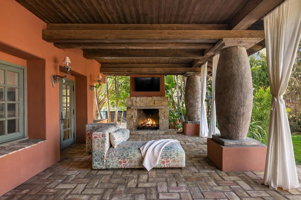 17116 Paseo Hermosa Rancho Santa Fe, CA 92067 - Photo 22 of 28 a front view of a house with outdoor seating