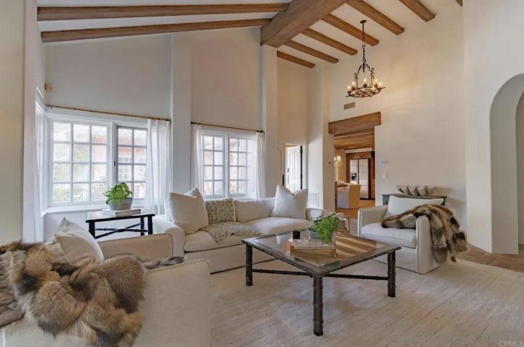 17116 Paseo Hermosa Rancho Santa Fe, CA 92067 - Photo 4 of 28 a living room with furniture wooden floor and a chandelier