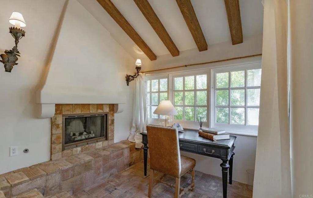 17116 Paseo Hermosa Rancho Santa Fe, CA 92067 - Photo 6 of 28 a livingroom with table and a fireplace
