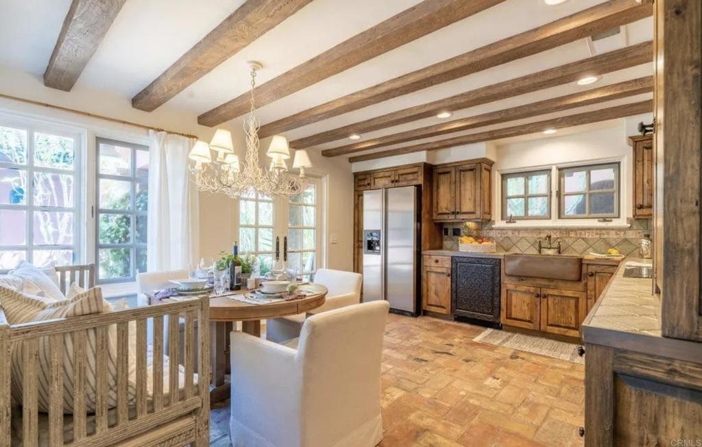 17116 Paseo Hermosa Rancho Santa Fe, CA 92067 - Photo 8 of 28 a dining room with furniture large windows a livingroom and kitchen view