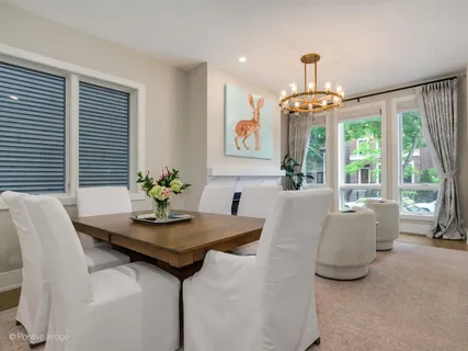 a dining room with furniture and window