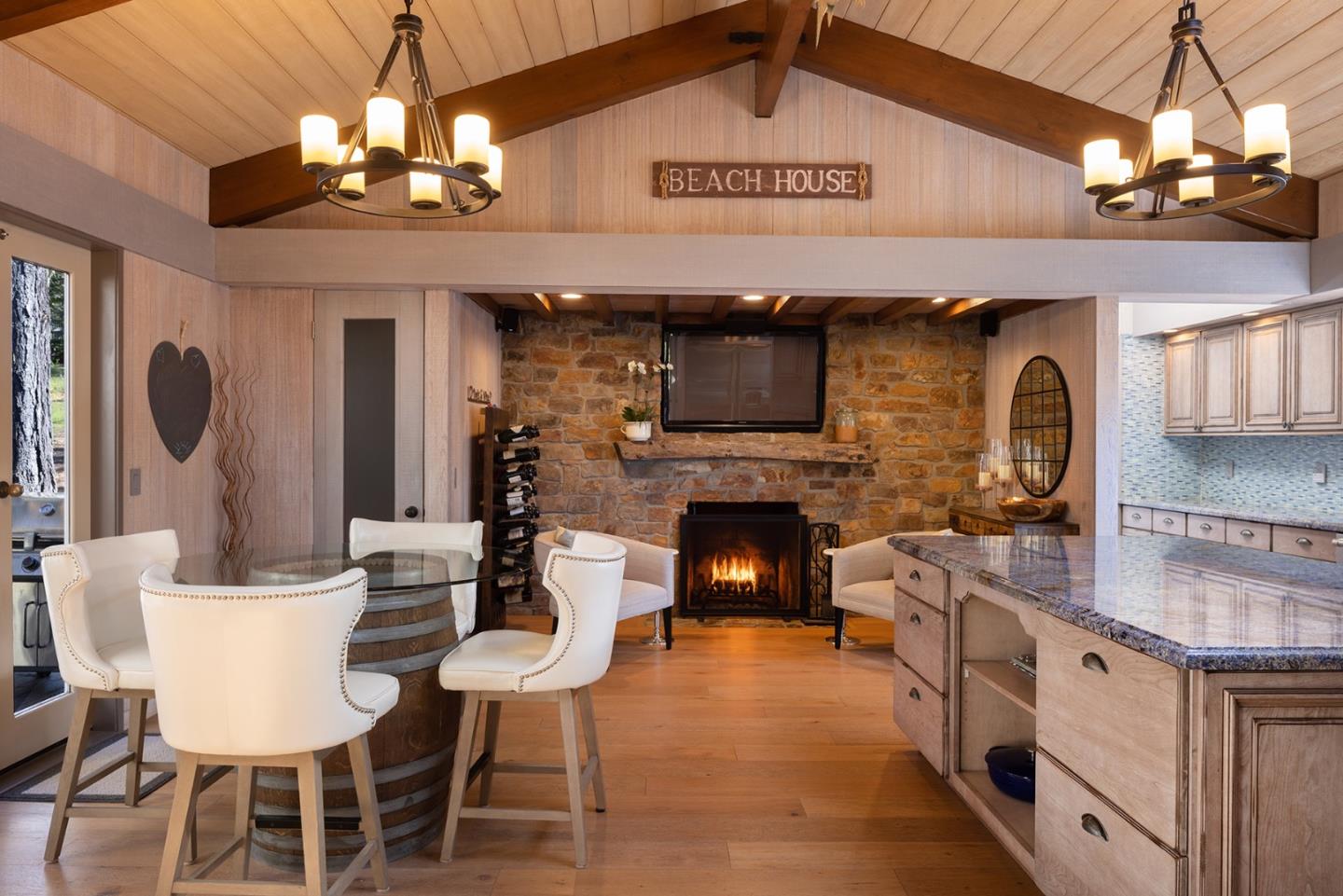 3893 Ronda Road Pebble Beach, CA 93953 - Photo 13 of 48 a view of a dining room with furniture wooden floor and chandelier