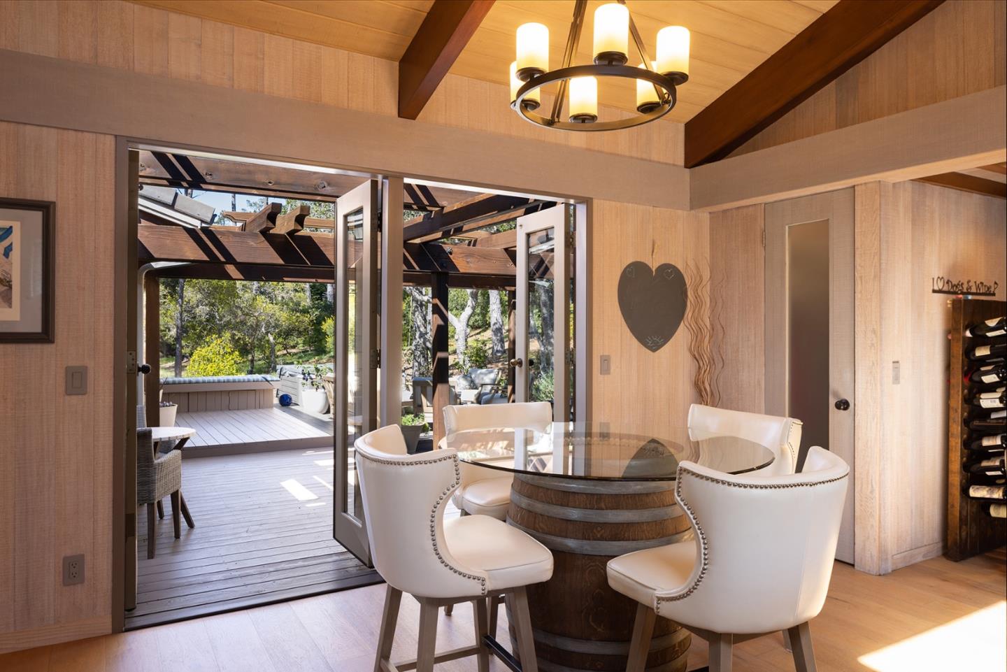 3893 Ronda Road Pebble Beach, CA 93953 - Photo 18 of 48 a view of a dining room with furniture wooden floor and chandelier