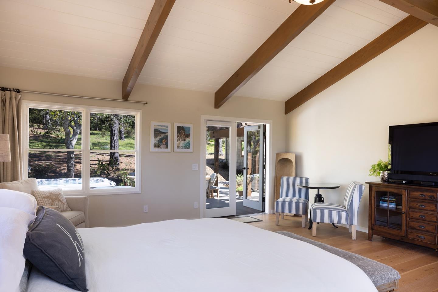 3893 Ronda Road Pebble Beach, CA 93953 - Photo 27 of 48 a bedroom with furniture and flat screen tv
