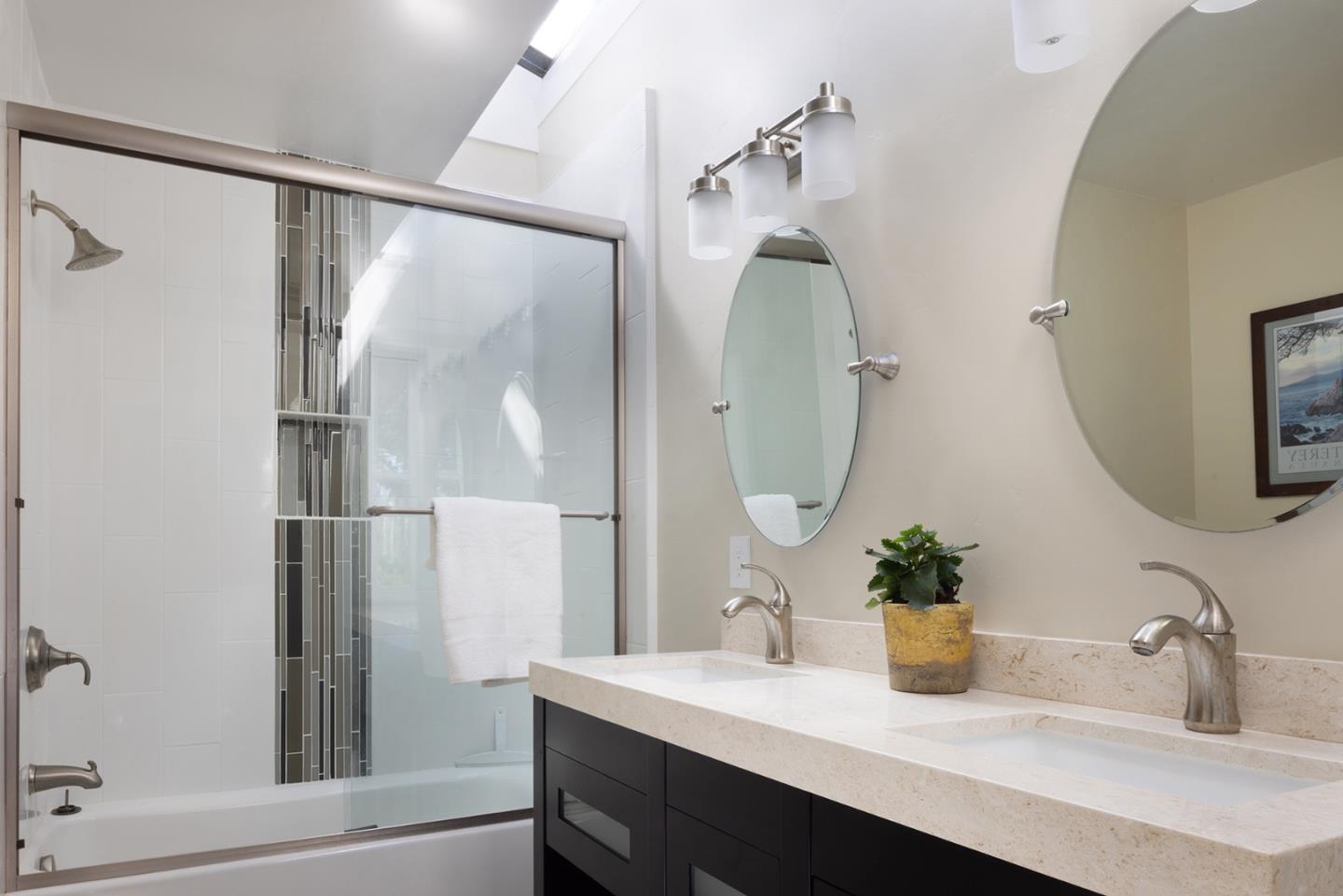 3893 Ronda Road Pebble Beach, CA 93953 - Photo 31 of 48 a bathroom with a sink and a mirror