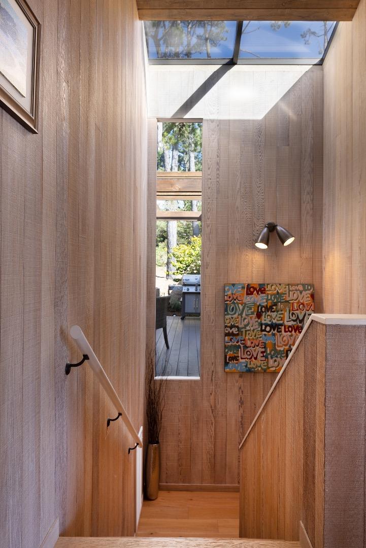 3893 Ronda Road Pebble Beach, CA 93953 - Photo 32 of 48 a view of a hallway with furniture and a window