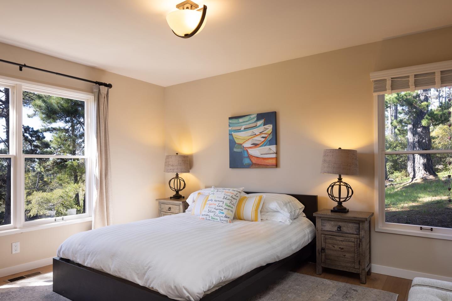 3893 Ronda Road Pebble Beach, CA 93953 - Photo 34 of 48 a bedroom with a bed and a window