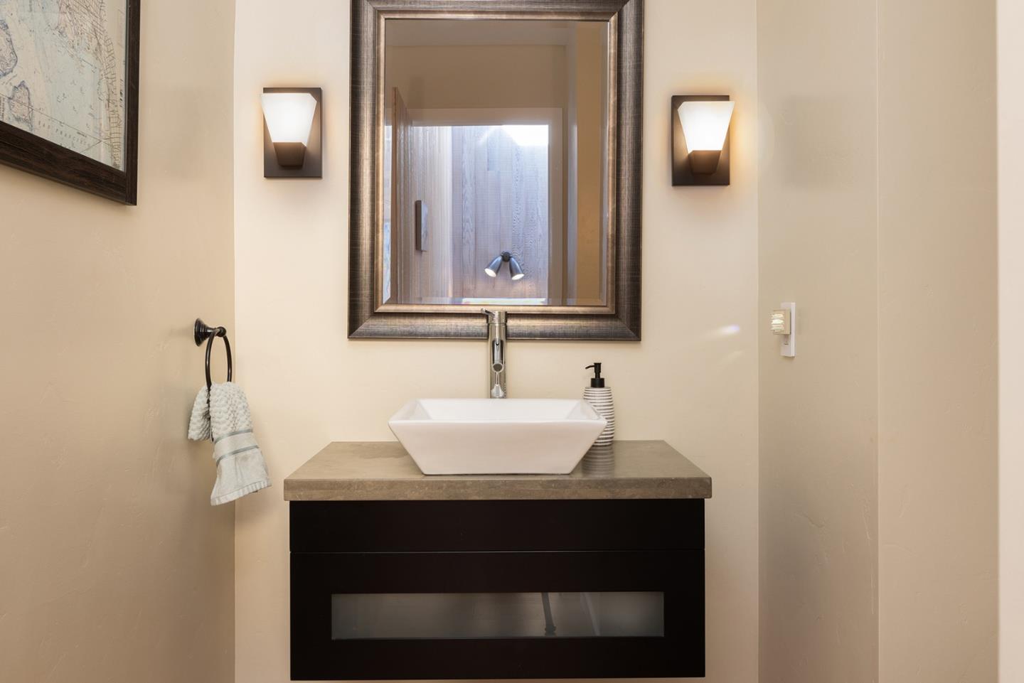 3893 Ronda Road Pebble Beach, CA 93953 - Photo 37 of 48 a bathroom with a sink and a mirror