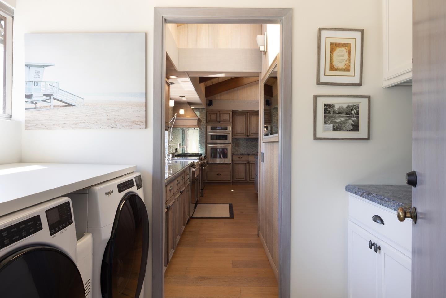 3893 Ronda Road Pebble Beach, CA 93953 - Photo 38 of 48 a view of a storage & utility room dryer and washer