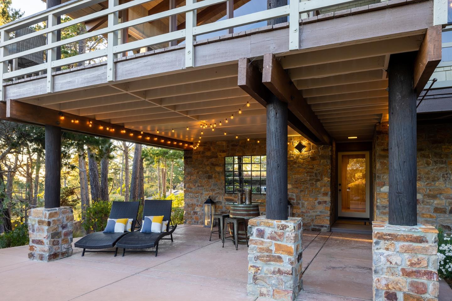 3893 Ronda Road Pebble Beach, CA 93953 - Photo 40 of 48 a patio with a table and chairs and potted plants