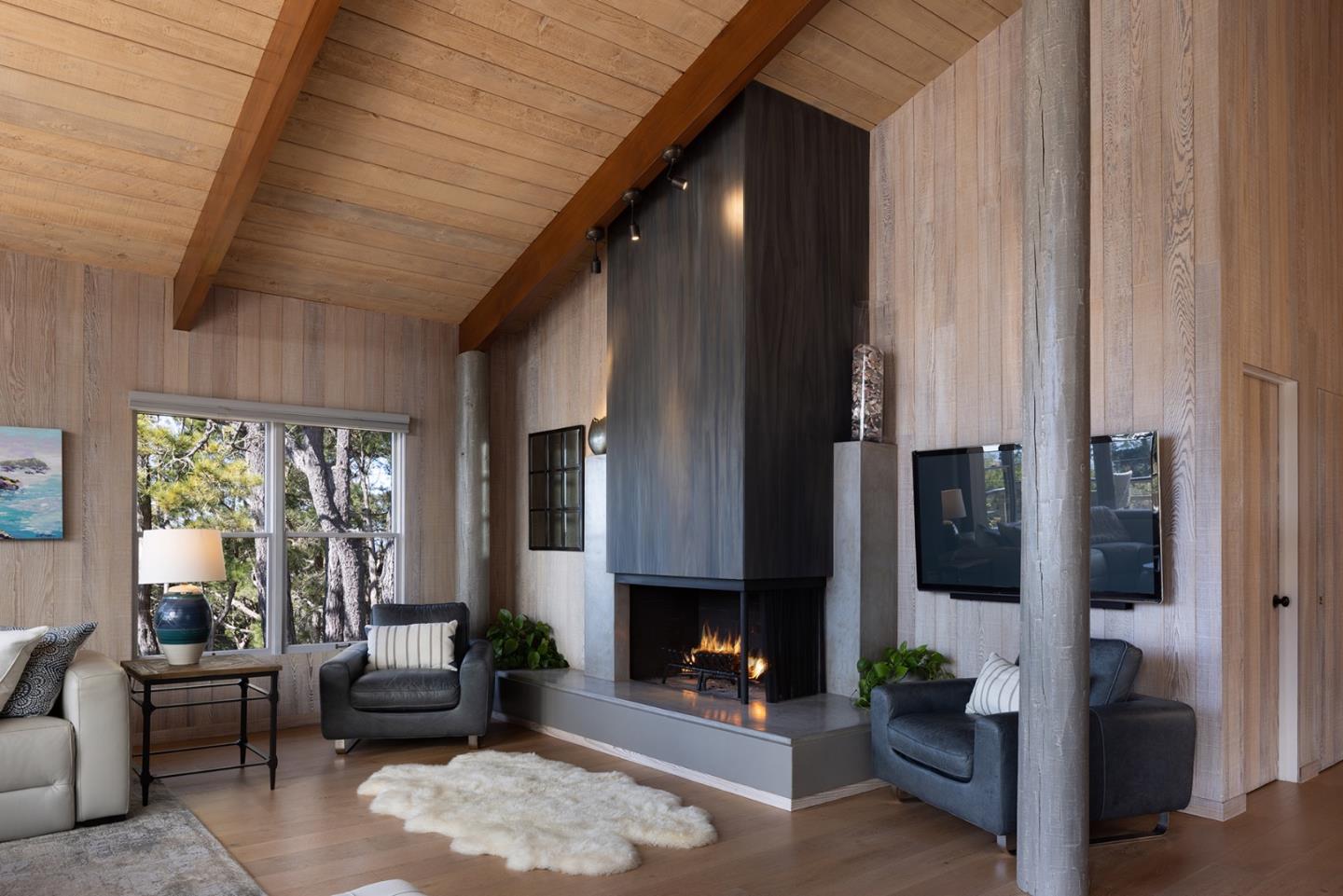 3893 Ronda Road Pebble Beach, CA 93953 - Photo 8 of 48 a living room with furniture and a fireplace