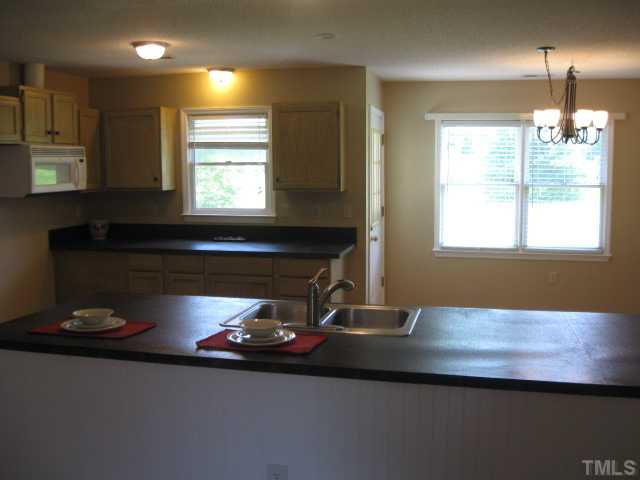 2322 White Memorial Church Road Willow Spring, NC 27592 - Photo 5 of 23 Huge kitchen with bar countertop and an eat in dining area.