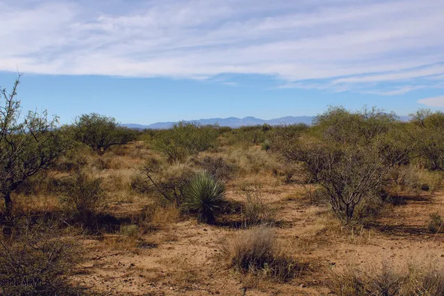 a view of mountain with sunset
