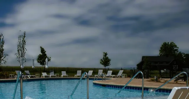 a view of house with swimming pool