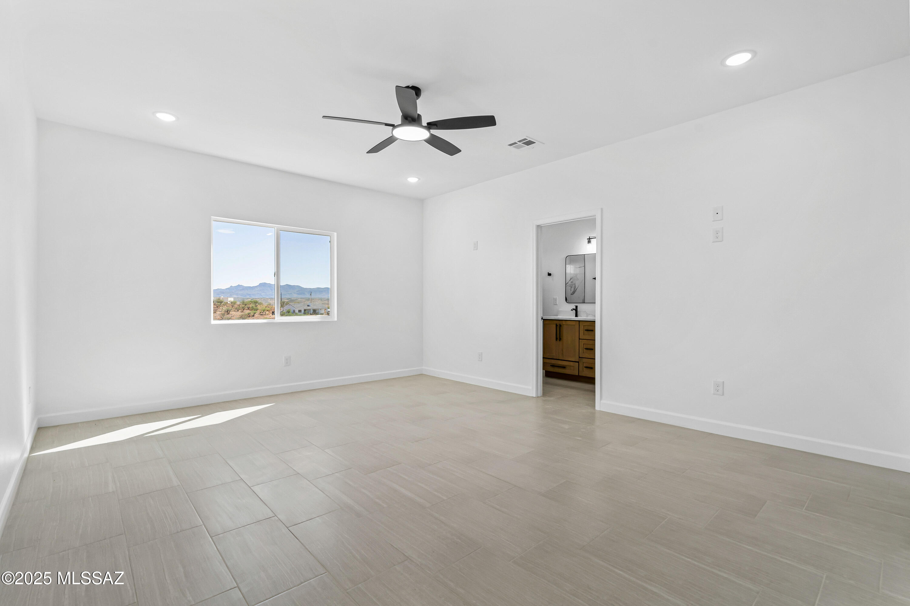 1674 Calle Cabo Rio Rico, AZ 85648 - Photo 16 of 33 a view of an empty room with a window