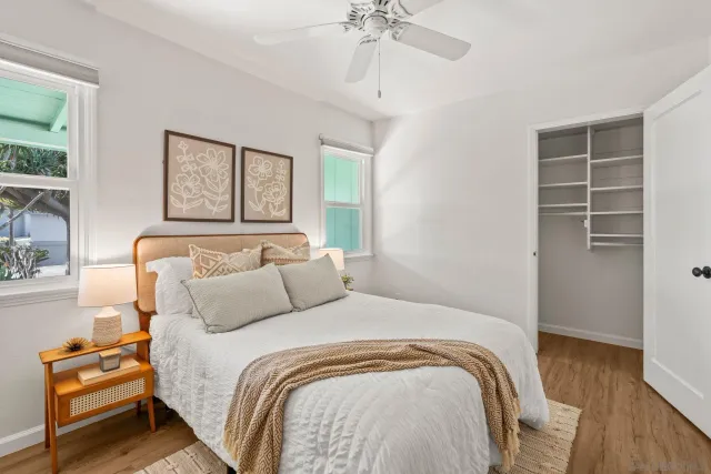 a bedroom with a bed and a window