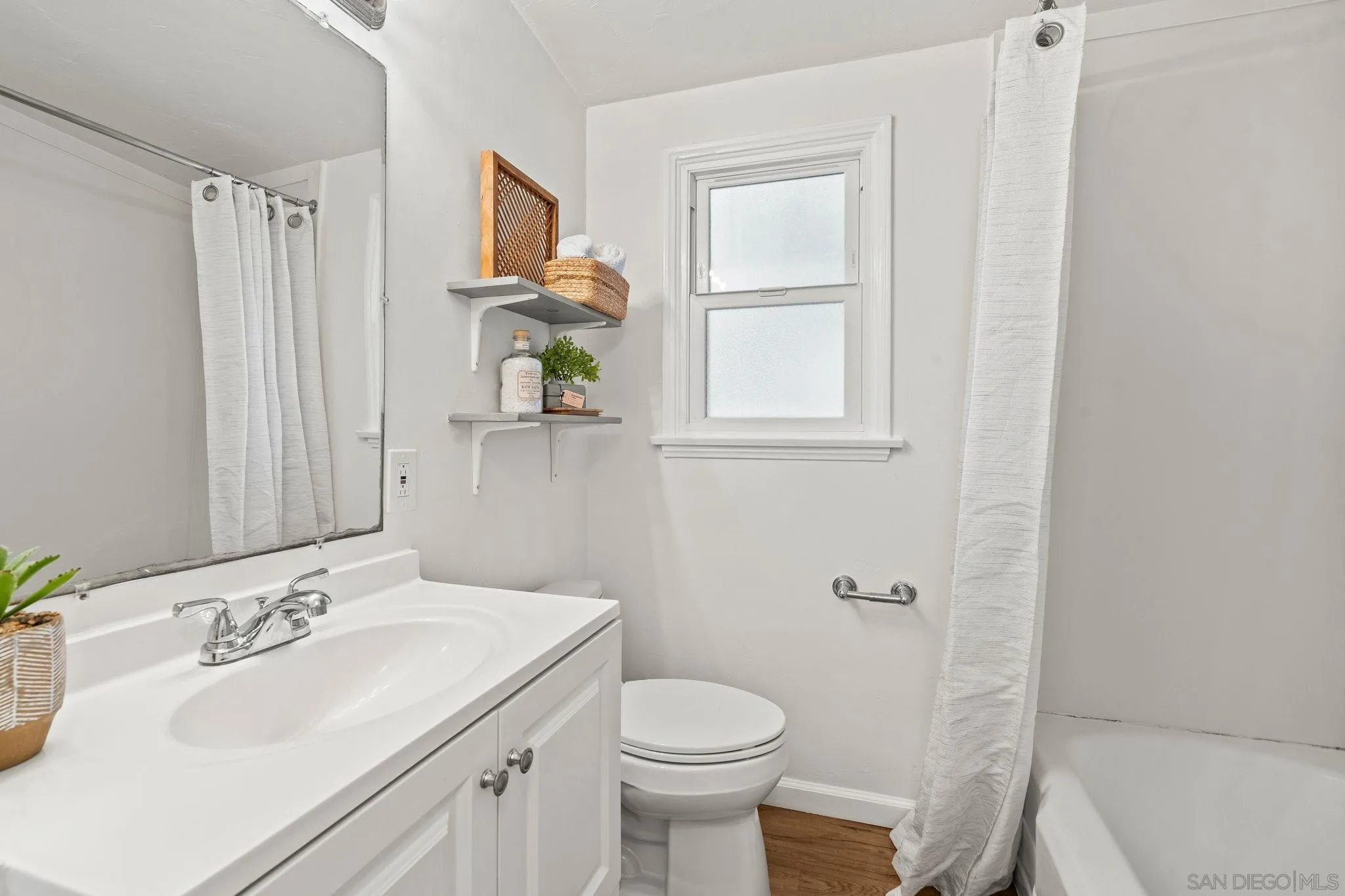 1395 Summit Avenue Cardiff, CA 92007 - Photo 19 of 47 a bathroom with a sink toilet and shower