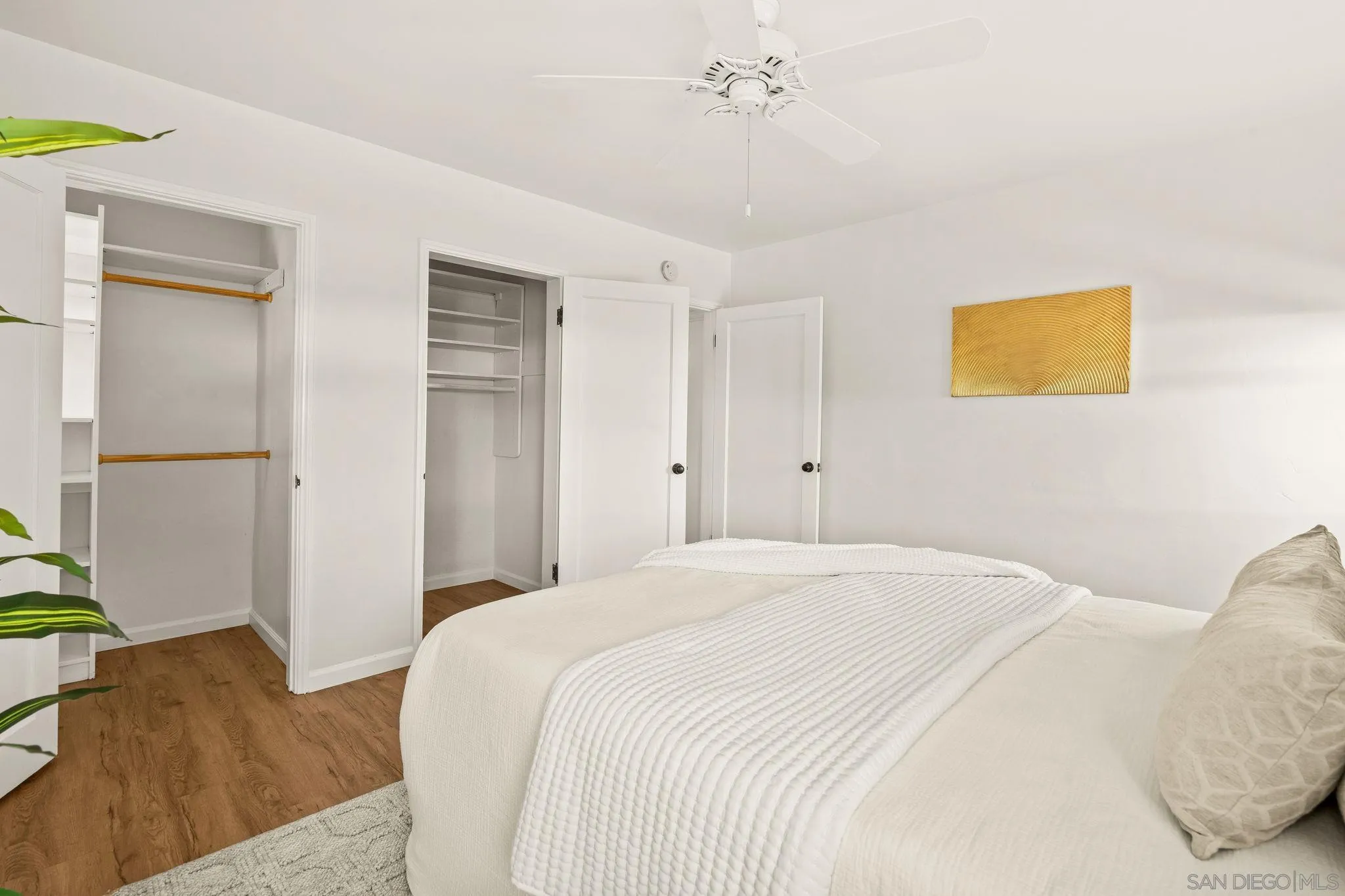 1395 Summit Avenue Cardiff, CA 92007 - Photo 24 of 47 a bedroom with a bed and a painting on the wall