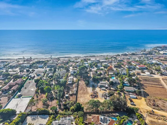 an aerial view of beach and ocean