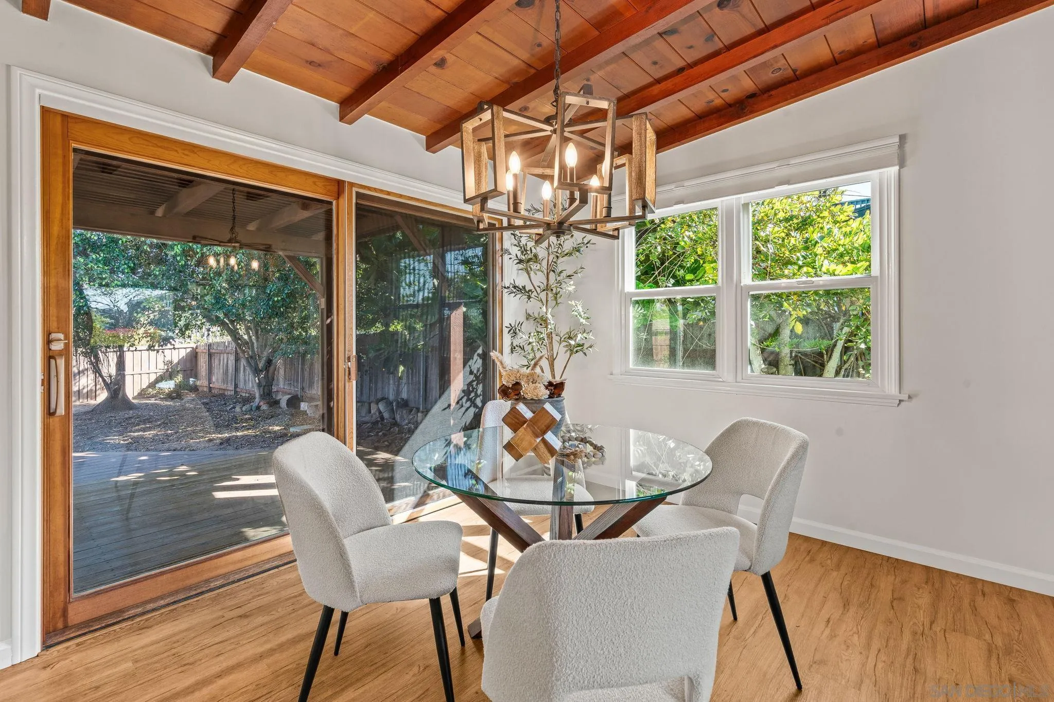 1395 Summit Avenue Cardiff, CA 92007 - Photo 9 of 47 a view of a dining room with furniture large windows and wooden floor