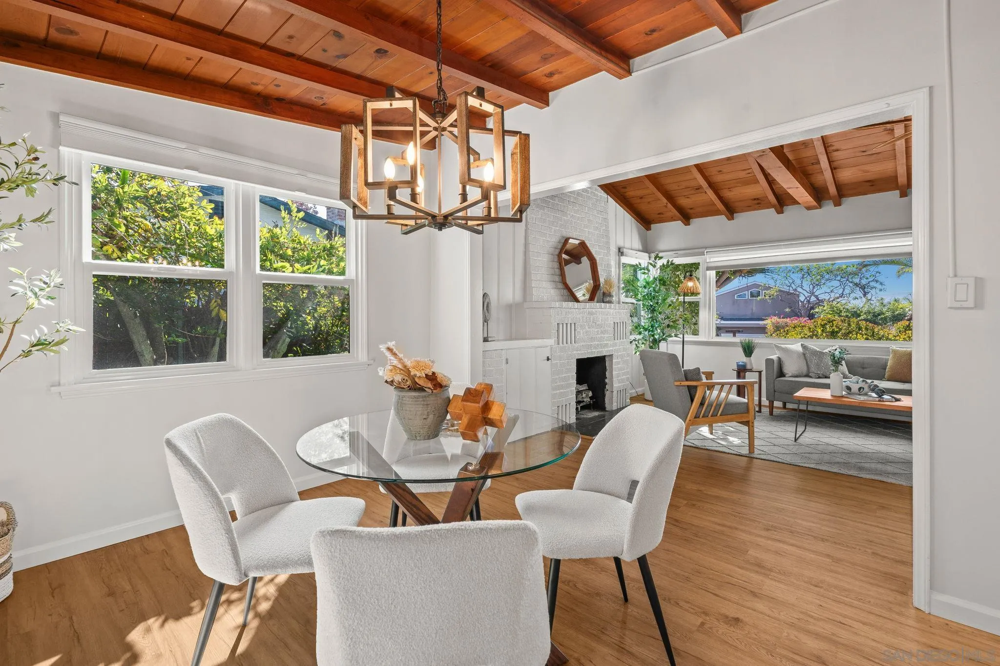 1395 Summit Avenue Cardiff, CA 92007 - Photo 10 of 47 a dining room with furniture a fireplace and wooden floor