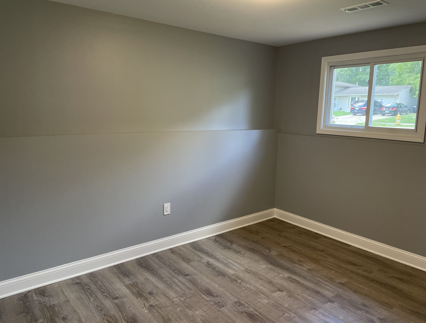 541 Spruce Road Bolingbrook, IL 60440 - Photo 13 of 21 wooden floor in an empty room with a window