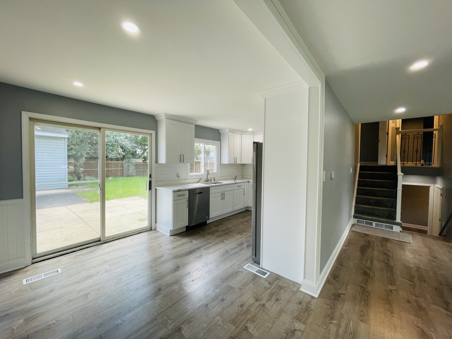 541 Spruce Road Bolingbrook, IL 60440 - Photo 4 of 21 a view of a kitchen with wooden floor and electronic appliances