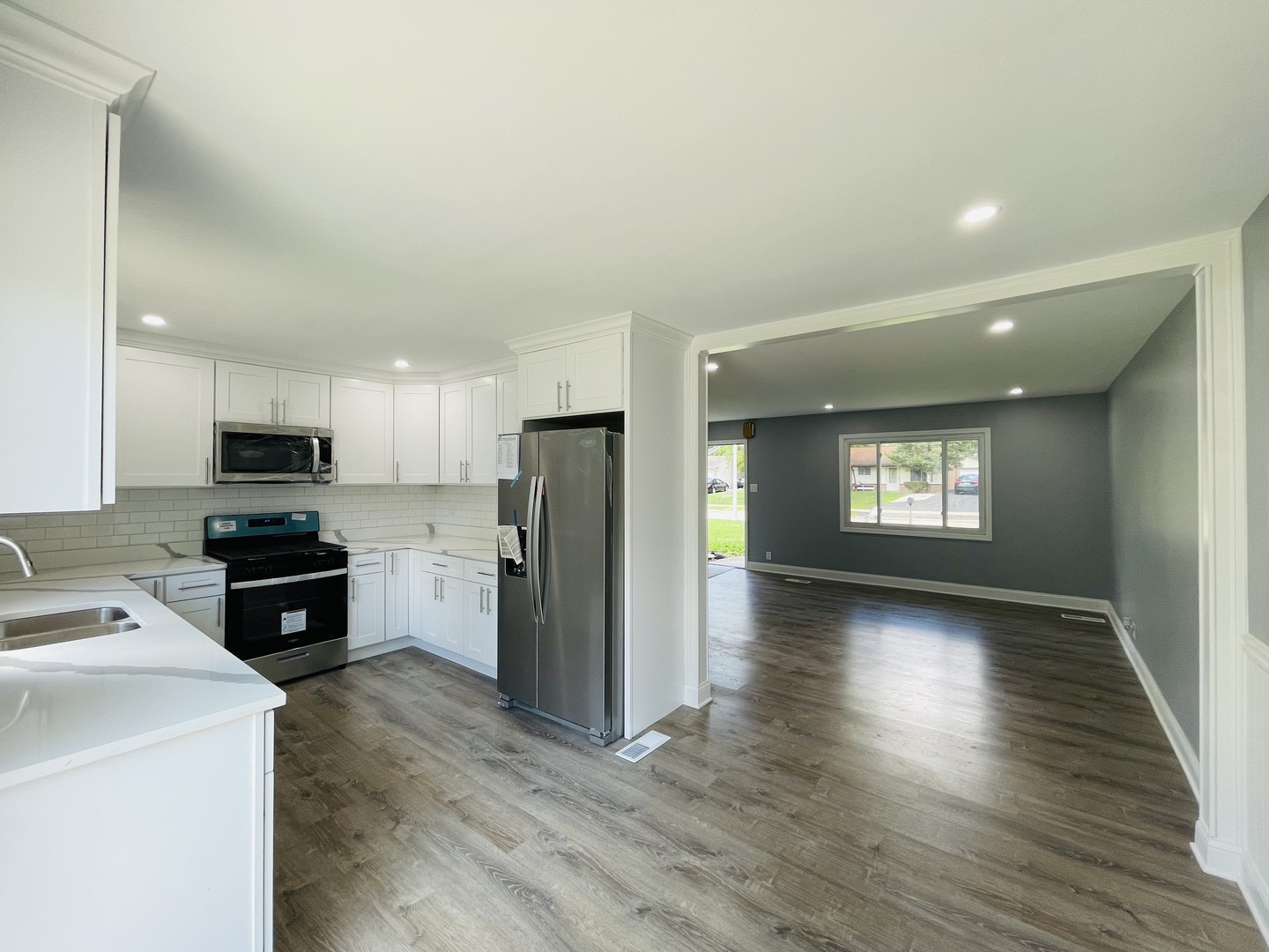 541 Spruce Road Bolingbrook, IL 60440 - Photo 5 of 21 a kitchen with stainless steel appliances a refrigerator and a stove top oven
