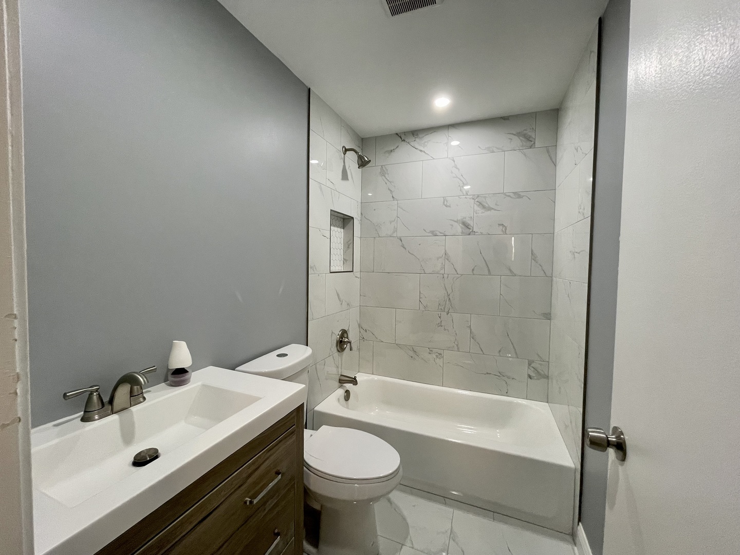 541 Spruce Road Bolingbrook, IL 60440 - Photo 8 of 21 a bathroom with a sink toilet mirror and shower