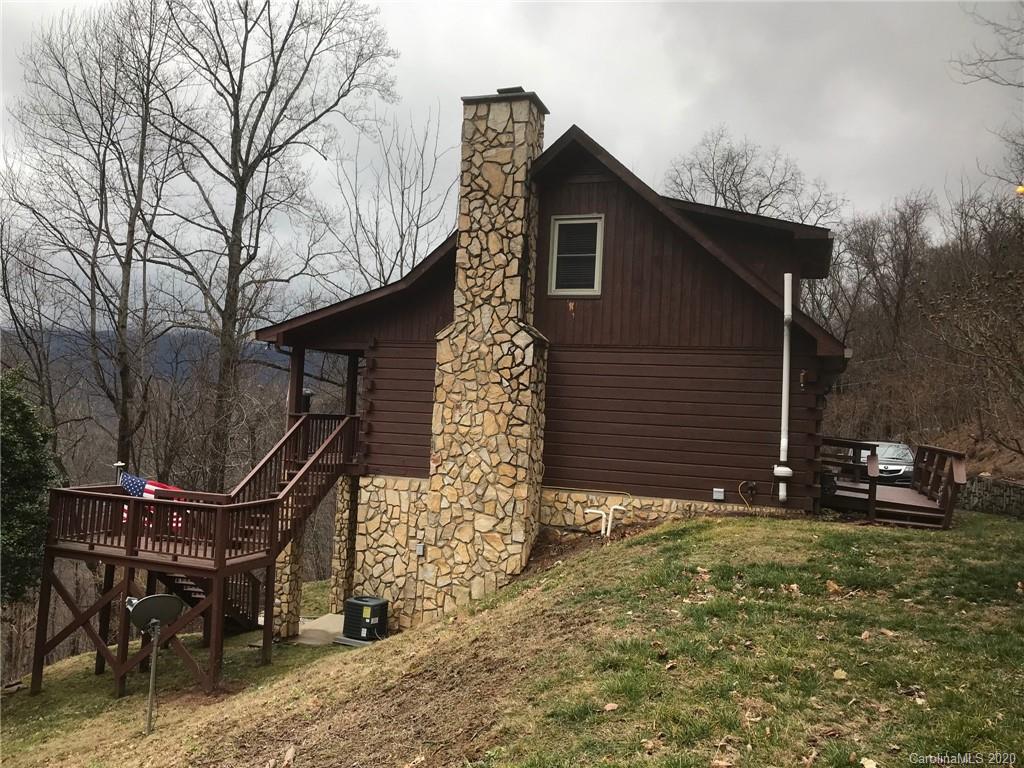 1364 Springbrook Farm Road Waynesville, NC 28786 - Photo 1 of 1 a front view of a house with garden
