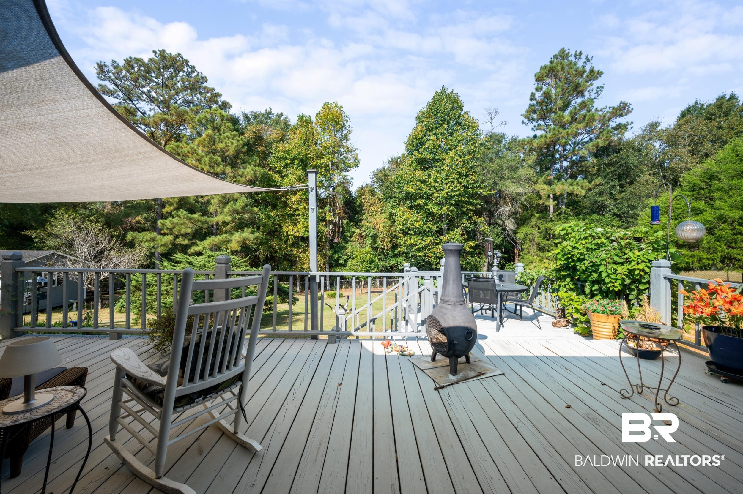 550 Norwood Road Monroeville, AL 36460 - Photo 30 of 46 Wooden terrace featuring view of scattered trees