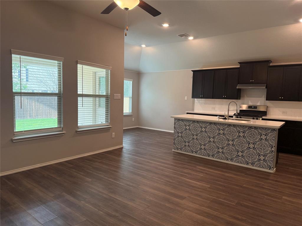 1004 Rising Moon Drive Fort Worth, TX 76052 - Photo 3 of 13 Open-concept living space with wood-finish flooring