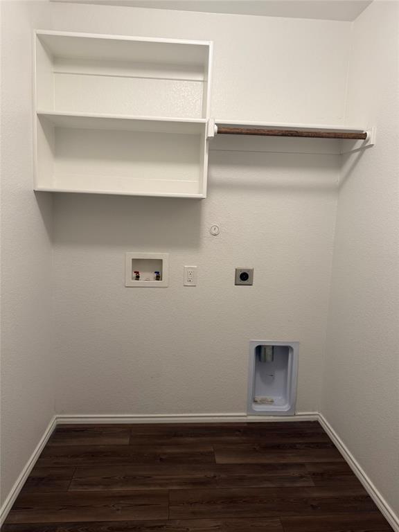 1004 Rising Moon Drive Fort Worth, TX 76052 - Photo 10 of 13 Dedicated laundry room featuring wood-finish flooring, white built-in shelving, and a hanging rod