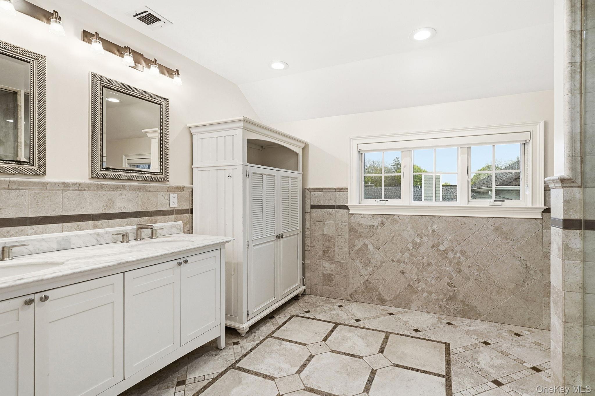 228 Central Avenue Rye, NY 10580 - Photo 13 of 24 a bathroom with a sink a toilet and large mirror