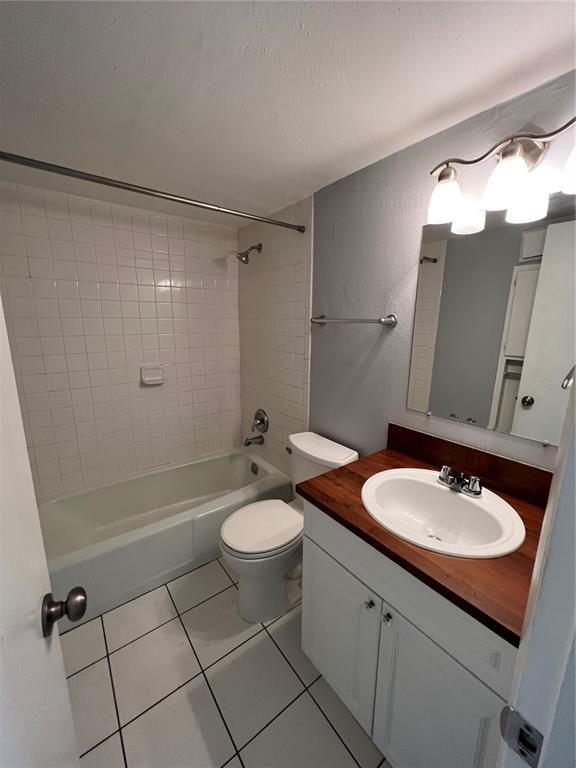 3206 West Azeele Street, Unit 100 Tampa, FL 33609 - Photo 12 of 15 a bathroom with a sink toilet and shower