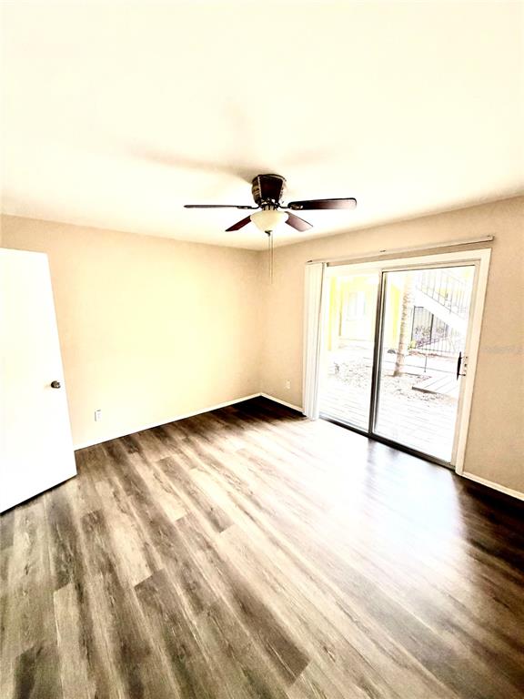 3206 West Azeele Street, Unit 100 Tampa, FL 33609 - Photo 10 of 15 a picture of a room with wooden floor