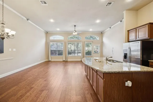 a view of a kitchen with a dishwasher cabinet and a fireplace
