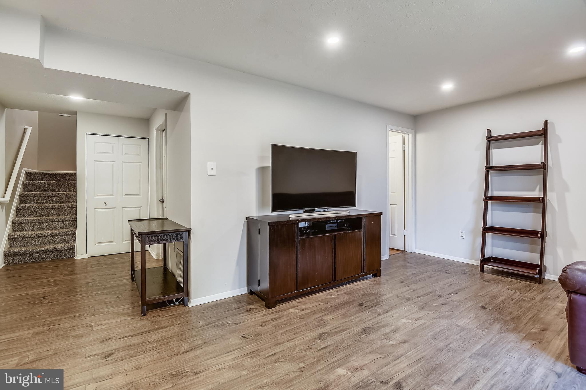 366 Rambling Ridge Court Pasadena, MD 21122 - Photo 28 of 32 Lower level family room with newer flooring